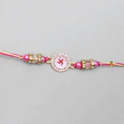 Clearance Pink Rakhi Adorned With An Embossed Swastik BOY Rakhis | Rakhis